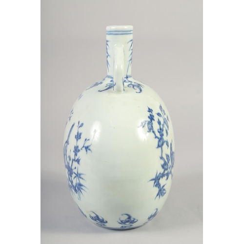 1140 - A CHINESE BLUE AND WHITE PORCELAIN MOON FLASK with twin handles and decorated with birds. 28cm high.... 