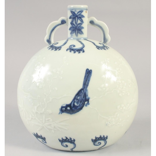 1145 - A CHINESE BLUE AND WHITE PORCELAIN MOON FLASK with twin handles, birds and carved decoration. 25.5in... 