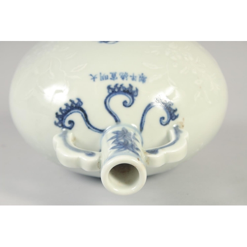 1145 - A CHINESE BLUE AND WHITE PORCELAIN MOON FLASK with twin handles, birds and carved decoration. 25.5in... 