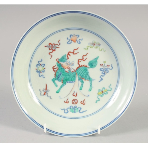 1151 - A CHINESE DOUCAI PORCELAIN DISH with Kylin and lucky objects. 21.5cm diameter.