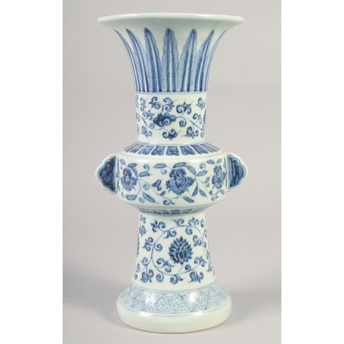 1152 - A CHINESE BLUE AND WHITE PORCELAIN GU VASE with floral decoration, six character mark to base. 33.5c... 