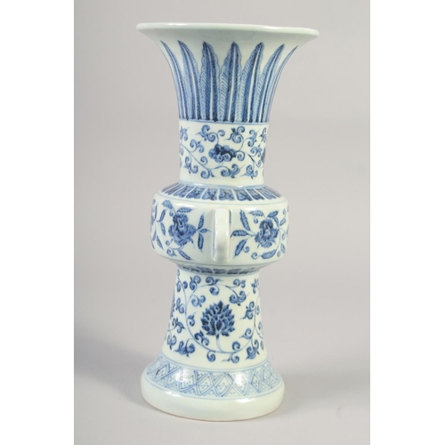 1152 - A CHINESE BLUE AND WHITE PORCELAIN GU VASE with floral decoration, six character mark to base. 33.5c... 