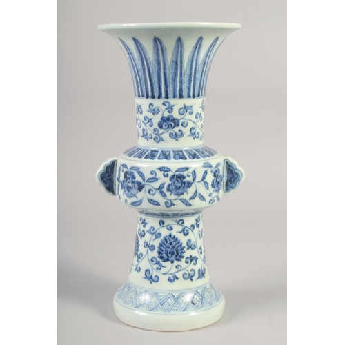 1152 - A CHINESE BLUE AND WHITE PORCELAIN GU VASE with floral decoration, six character mark to base. 33.5c... 