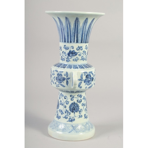 1152 - A CHINESE BLUE AND WHITE PORCELAIN GU VASE with floral decoration, six character mark to base. 33.5c... 