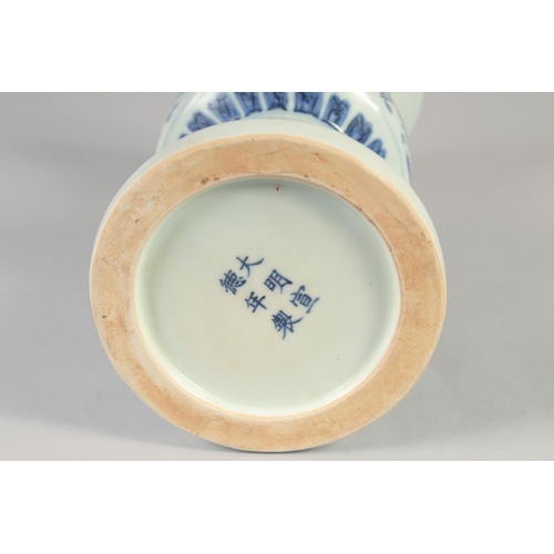 1152 - A CHINESE BLUE AND WHITE PORCELAIN GU VASE with floral decoration, six character mark to base. 33.5c... 