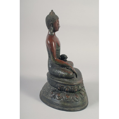 1159 - A LARGE BRONZE SEATED BUDDHA. 12ins long.