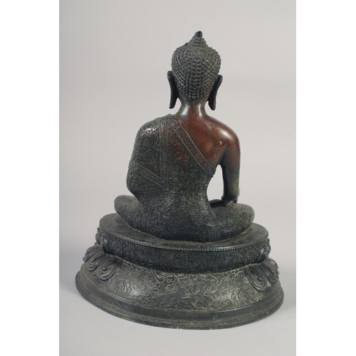 1159 - A LARGE BRONZE SEATED BUDDHA. 12ins long.