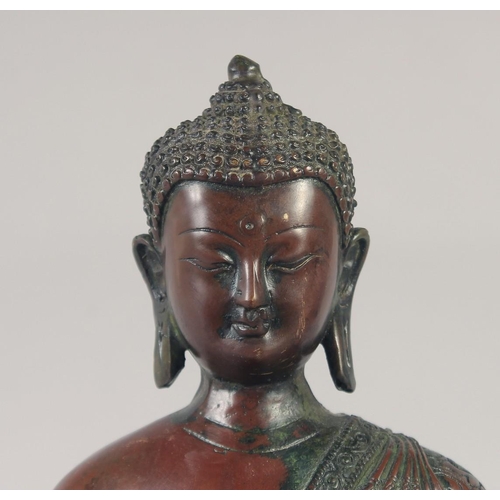 1159 - A LARGE BRONZE SEATED BUDDHA. 12ins long.