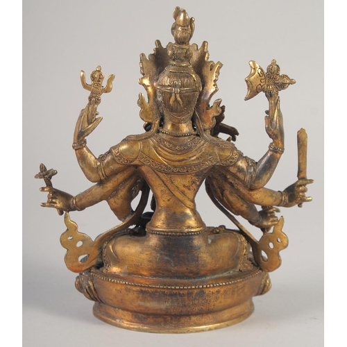 1161 - A GILT BRONZE BUDDHA with eight arms, set with stones.