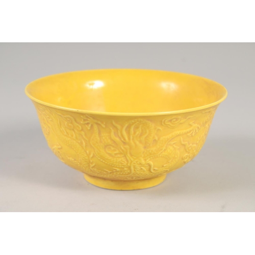 1167 - A CHINESE YELLOW PORCELAIN DRAGON BOWL 6ins diameter.