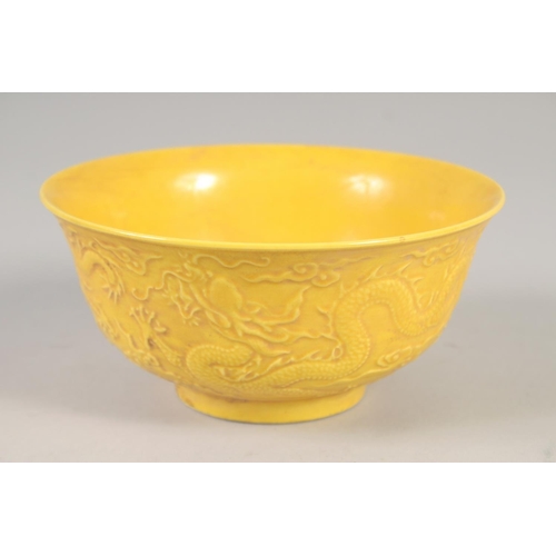 1167 - A CHINESE YELLOW PORCELAIN DRAGON BOWL 6ins diameter.