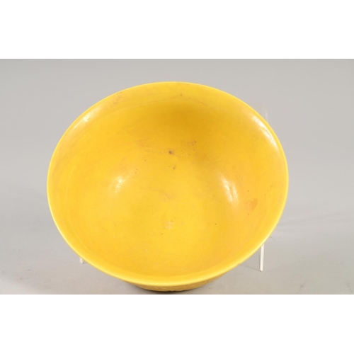 1167 - A CHINESE YELLOW PORCELAIN DRAGON BOWL 6ins diameter.