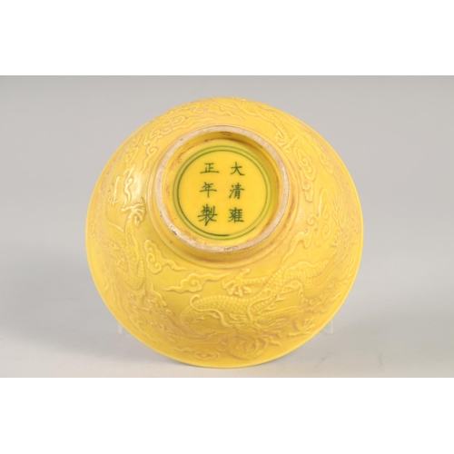 1167 - A CHINESE YELLOW PORCELAIN DRAGON BOWL 6ins diameter.