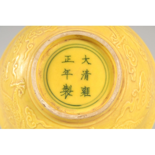 1167 - A CHINESE YELLOW PORCELAIN DRAGON BOWL 6ins diameter.