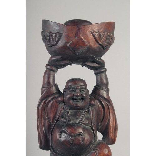 1173 - A CARVED ROSEWOOD BUDDHA. 26ins long.