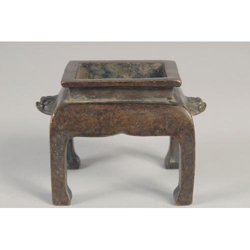 1177 - A GOOD CHINESE CENSER on four legs. 4ins high.