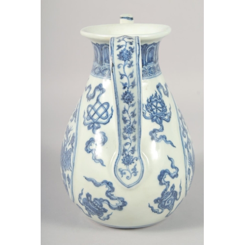 1179 - A CHINESE BLUE AND WHITE PORCELAIN EWER, decorated with phoenix and auspicious symbols, 21.5cm high.