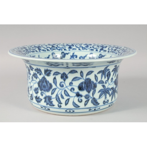 1180 - A CHINESE BLUE AND WHITE PORCELAIN WASH BASIN, decorated with flower heads and vine, the interior ce... 