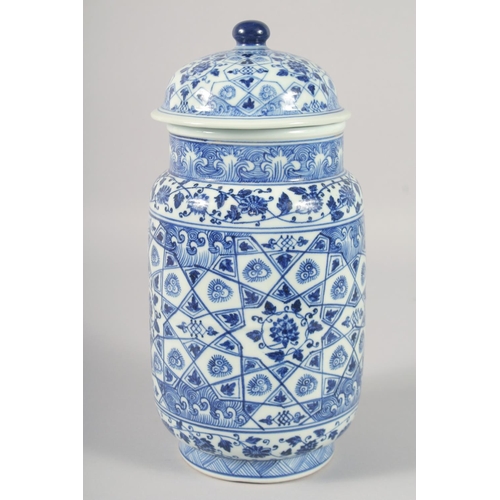 1188 - A CHINESE BLUE AND WHITE PORCELAIN CYLINDRICAL JAR AND COVER, decorated with various floral motifs. ... 