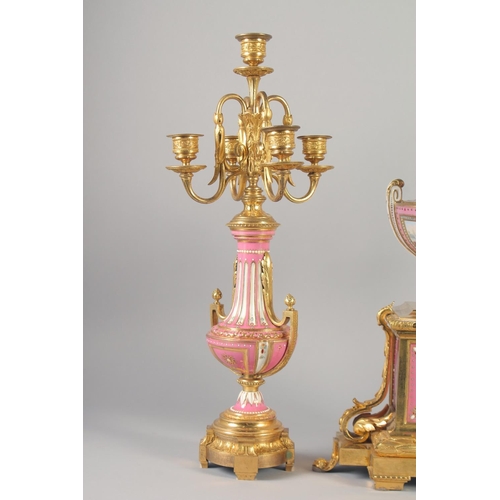 1193 - A SUPERB LOUIS XVI GILT BRONZE AND PINK PORCELAIN CLOCK GARNITURE DE CHEMINEE. The clock with Madame... 