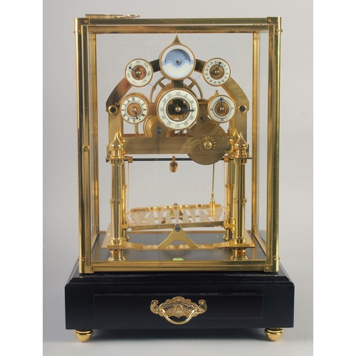 1200 - A VERY GOOD GILT MOONPHASE CONGREAVE CLOCK with six dials in a glass frame, the base with single dra... 