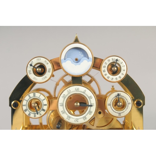 1200 - A VERY GOOD GILT MOONPHASE CONGREAVE CLOCK with six dials in a glass frame, the base with single dra... 