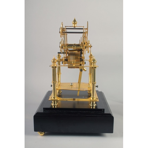 1200 - A VERY GOOD GILT MOONPHASE CONGREAVE CLOCK with six dials in a glass frame, the base with single dra... 