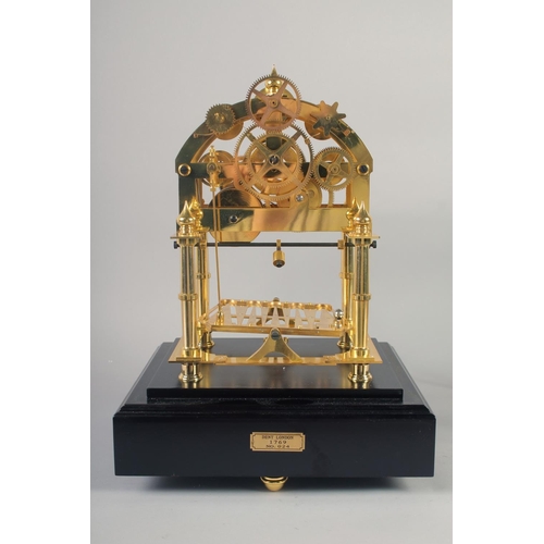 1200 - A VERY GOOD GILT MOONPHASE CONGREAVE CLOCK with six dials in a glass frame, the base with single dra... 