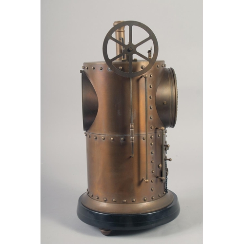 1203 - A BRONZE CYLINDER INDUSTRIAL CLOCK with cream dial. 16ins high.