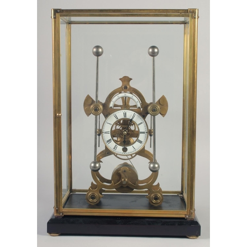 1206 - A BRASS SKELETON CLOCK with two enamel dials in a glass case. 19ins high.