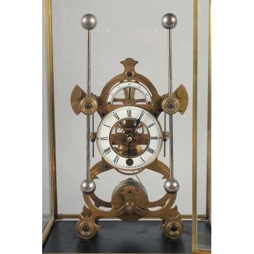 1206 - A BRASS SKELETON CLOCK with two enamel dials in a glass case. 19ins high.