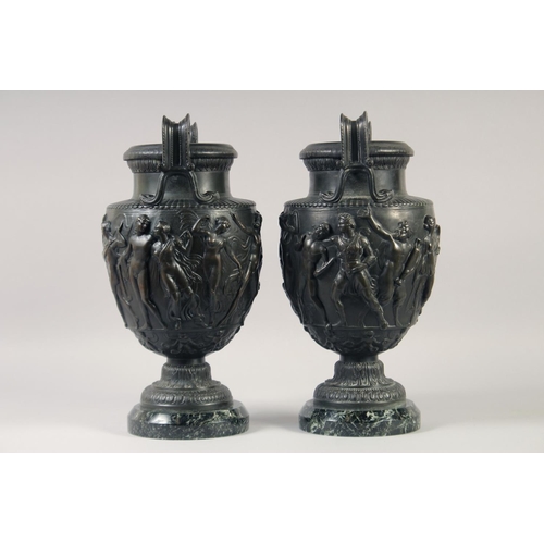 1232 - A VERY GOOD PAIR OF CLASSICAL SKIMMED BRONZE TWO HANDLED URNS with a band of classical figures, on a... 