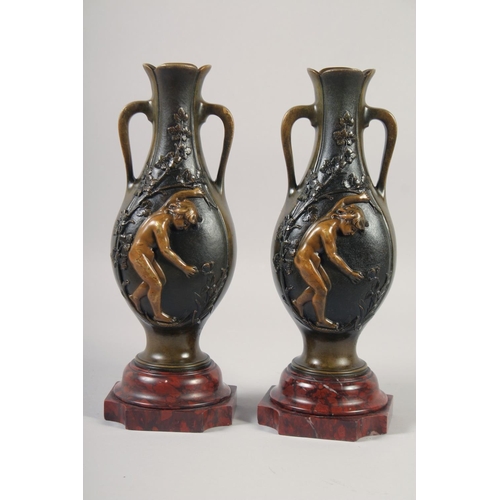 1234 - A VERY GOOD PAIR OF BRONZE AND GILDED BRONZE TWO HANDLED VASES with oval panels of a nude and flower... 