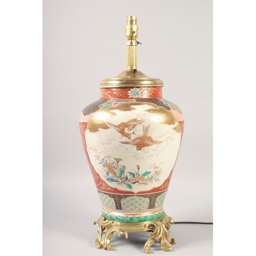 1235 - A GOOD MID 20TH CENTURY KUTANI PORCELAIN LAMP painted with birds with ormolu base. 16ins high.