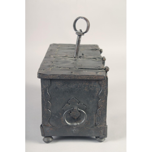 1238 - A RARE SMALL 16TH - 17TH IRON CHEST, the top opens to reveal a mechanism in the lid with iron bondin... 