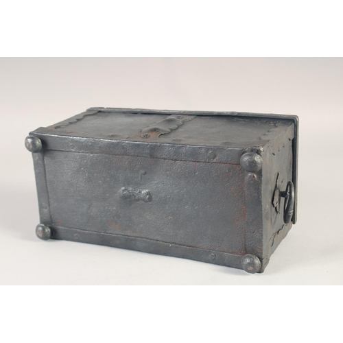 1238 - A RARE SMALL 16TH - 17TH IRON CHEST, the top opens to reveal a mechanism in the lid with iron bondin... 