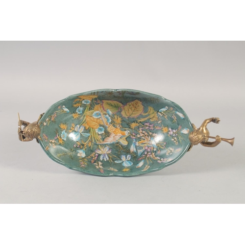 1248 - AN OVAL PORCELAIN COMPORT painted with birds and flowers with gilt cupid handles. 11ins wide.