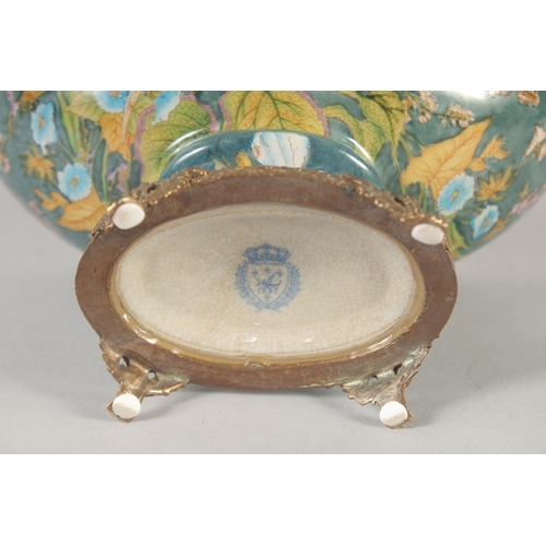 1248 - AN OVAL PORCELAIN COMPORT painted with birds and flowers with gilt cupid handles. 11ins wide.