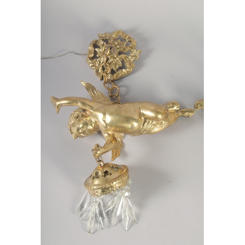 1277 - A GOOD PAIR OF GILT BRONZE CUPID WALL LIGHTS with cut glass prism drop. 12ins long.