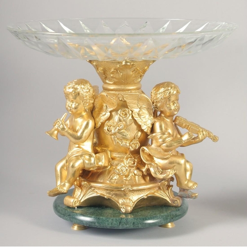 1279 - A VERY GOOD PAIR OF GILT BRONZE COMPORTS with gilt bowls and cupid supports.