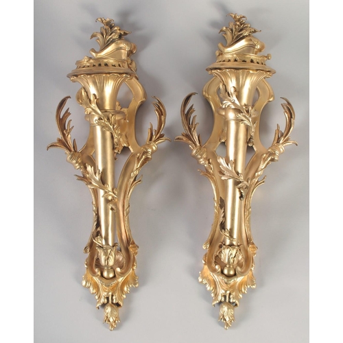 1280 - A VERY GOOD PAIR OF GILT BRONZE WALL CORNETS with acanthus scrolls and torch. 24ins long.