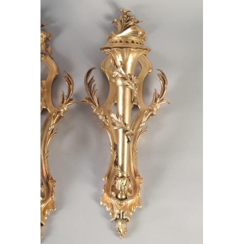 1280 - A VERY GOOD PAIR OF GILT BRONZE WALL CORNETS with acanthus scrolls and torch. 24ins long.