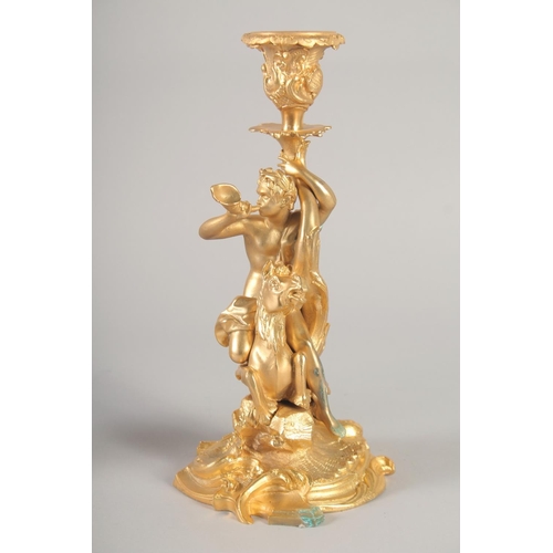 1281 - A GOOD PAIR OF GILT BRONZE CANDLESTICKS, the stems with classical figures, semi nude and man riding ... 