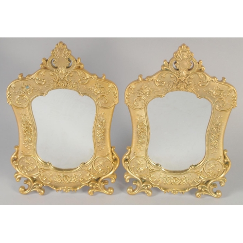 1282 - A PAIR OF GILT BRONZE EASEL STANDING MIRRORS. 12ins x 7.5ins.