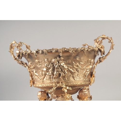 1284 - A SUPERB GILT BRONZE CHERUB CENTRE PIECE hung with fruiting vines and cupids. 16ins high x 16ins lon... 