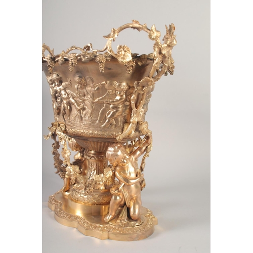 1284 - A SUPERB GILT BRONZE CHERUB CENTRE PIECE hung with fruiting vines and cupids. 16ins high x 16ins lon... 