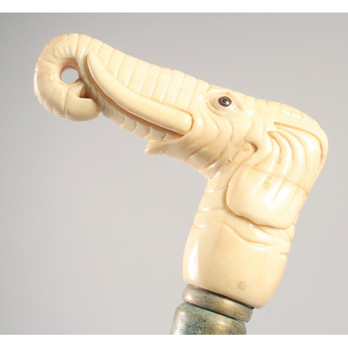 1290 - A WALKING STICK with carved bone handle 