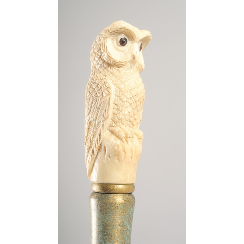 1292 - A WALKING STICK with carved bone handle 