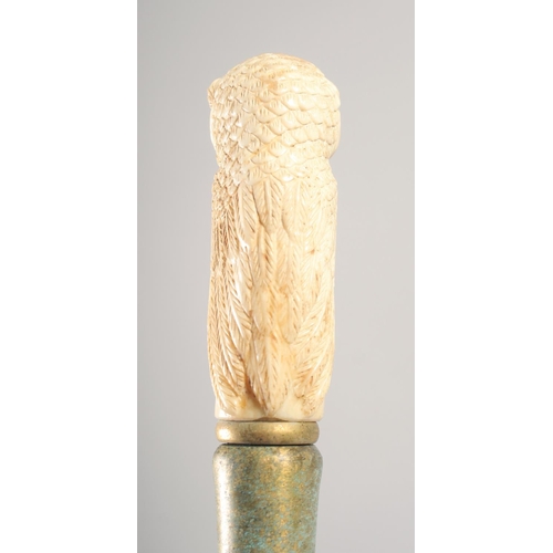 1292 - A WALKING STICK with carved bone handle 