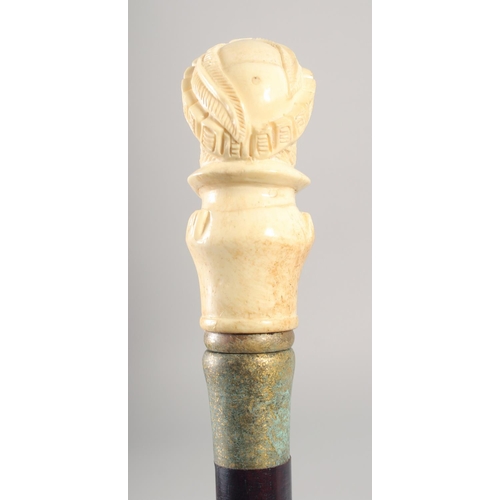 1294 - A WALKING STICK with carved bone handle 